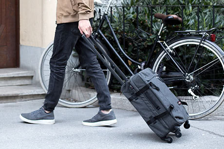 A man carrying a suitcase