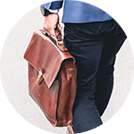 A stock image detail of a manager holding a satchel