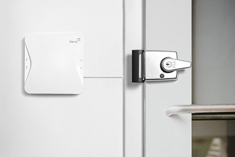 A Klevio smart lock device connected to a door lock
