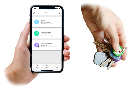 One hand holds a smartphone with a smart lock app showing digital keys, while another hand holds traditional keys and fobs